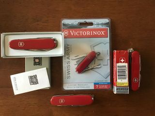 3 Victorinox And 1 Wenger Swiss Army Knife