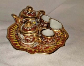 10 Piece Miniature Porcelain Tea Set Gold Lotus Flower Design