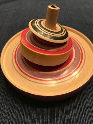 Wooden Spinning Top Board With Colorful Spinning Disks.