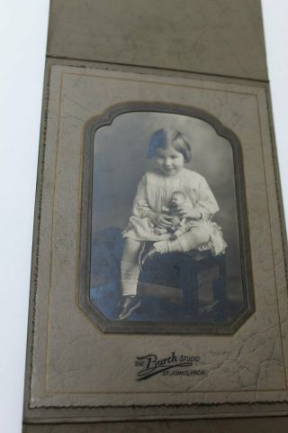 Vintage Sepia Cabinet Photo - Little Girl Holding A Doll Sitting On A Bench