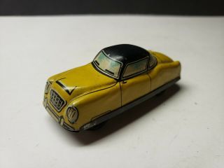 Vintage German Tin Toy Miniature Car Yellow Sedan