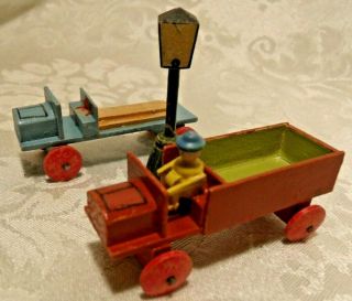 2 Vintage Folk Art All Wood 2.  5 " Toy Trucks,  Carved Light Post