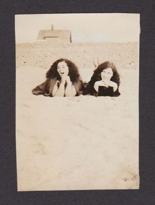 2 Young Ladies W/long Hair Laying Sandy Beach Old/vintage Photo Snapshot - H240