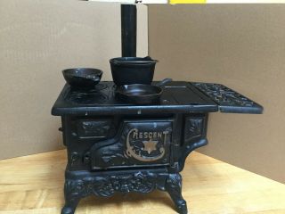 Vintage Crescent Cast Iron Miniature Toy Stove With Accessories.  Shape