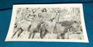 Photo Of 2 Armed Natives On Horses Bare Back In Jungle With Many Body Tattoos