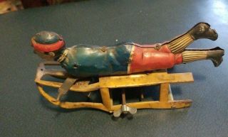 Boy On Sled Pressed Steel; Toy On Runner Sled Wind Up Toy Needs Arms Wheels