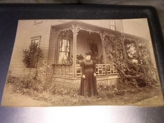 Vintage Portrait Of Lady Dressed In Black In Front Of Her Home Photo