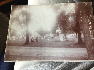 Vintage 2 Men Sitting On A Bench In A Cemetery Photo