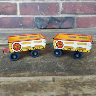 2 Vintage Courtland Tin Litho Toy Delivery Wagons W/ Wood Wheels - Hard To Find