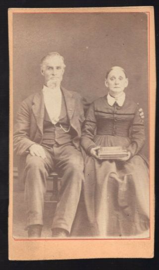 Cdv Photo Of Older Couple Man In Suit Lady In Fine Dress Holding Album