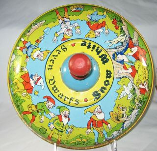 Spinning Tin Musical Top,  Red,  Blue,  Yellow,  Green,  Snow White & 7 Dwarfs Chein
