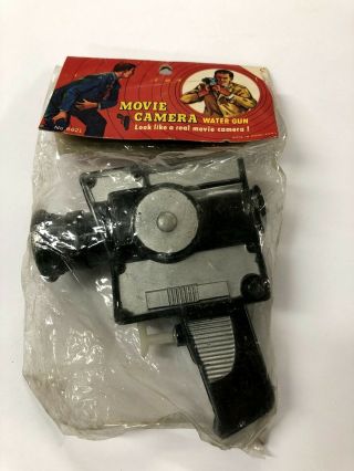 Elc001_013a Movie Camera Water Gun In Package