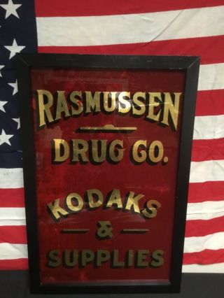 Rare.  Antique 1890s Rasmussen Drug Co.  Reverse Painted Advertising Glass Sign