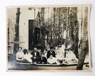 Vintage Snapshot Of People Sitting In A Boat At Summer House