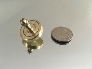 Brass spinning top with ceramic bearing and blue swirl design (over 5 min spin) 3
