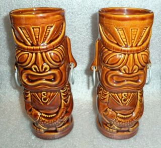 Matched Pair Brown Glazed Pottery Tiki Mug Advertising Emeril 