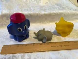 Plastic Sippy Cup,  Rubber Grey Pencil Sharpener,  Yellow Rubber Squeeze Elephant