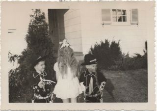 2 Little Cowboys In Hopalong Cassidy Outfits Flanking Girl Seen From Back,  50s