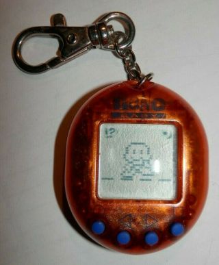 Vintage Orange Nano Baby Tamagotchi - Giga Pet Virtual Pet Playmates 1997