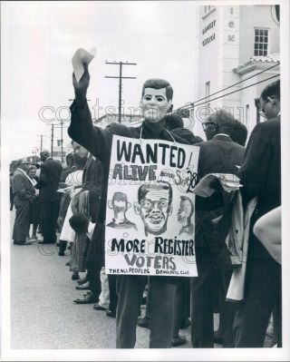 1963 Press Photo Civil Rights Worker Wearing John Kennedy Mask 1960s