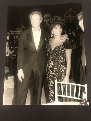 Clinton Eastwood,  Joan Collins 7x 9 Vintage Press Photo 1987