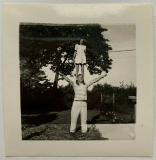Vintage 1940s Snapshot Of Woman Standing On Top Of Man 