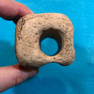 Unique authentic pottery artifact with central hole and two side grooves,  SW US 2