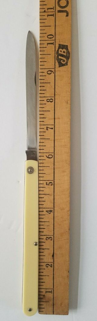 SCHRADE,  USA 105 MELON TESTER KNIFE,  (sampler),  ivory plastic,  Brass liner,  5 3/4 