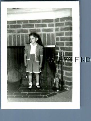 Found B&w Photo E,  6111 Girl In Dress Standing By Fireplace