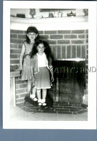 Found B&w Photo E,  6105 Girls In Dresses Standing By Fireplace