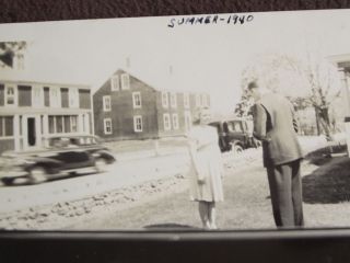 LOOKING THROUGH THE CAR WINDOW AT A MAN TAKING A PICTURE OF A GIRL 1940 PHOTO 2