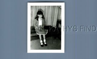 Found B&w Photo E,  6107 Girl In Dress Sitting On Table