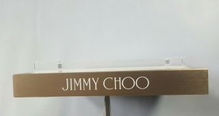 JIMMY CHOO GOLD & WHITE ONE PIECE LOGO DISPLAY IN STEEL METAL BRONZE PLEXIGLASS 2