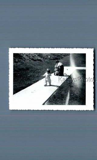 Black & White Photo F,  1347 Little Girl Walking,  Light Anomaly