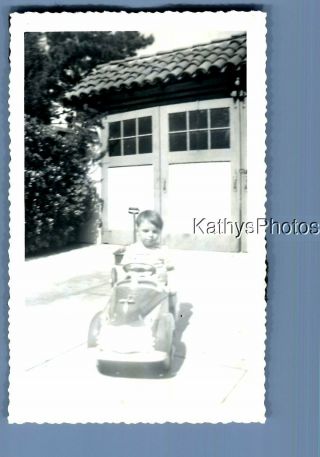 Black & White Photo F,  0278 Little Boy Sitting In Pedal Car In Driveway