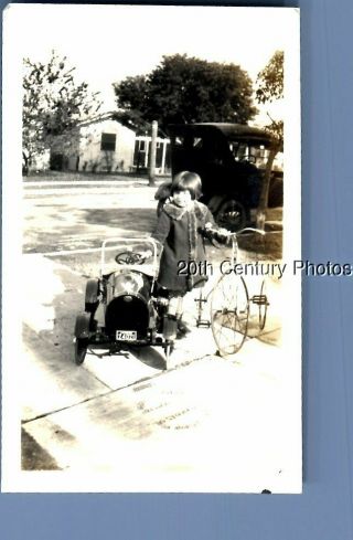 Found B&w Photo K,  8734 Little Girl By Pedal Car,  Tricycle