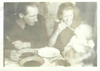 1729p Vintage Photo Pretty Mom Is Feeding Their Baby While Dad Watches