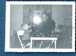 Found B&w Photo F,  3743 Man Sitting At Table Wiht Little Boy,  Light On Tv