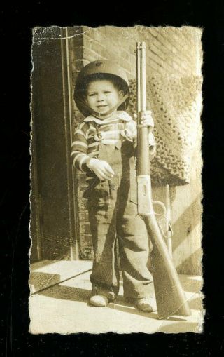 Vintage Photo Young Boy In Helmet Holds Rifle Long Gun In Overalls Braided Rug