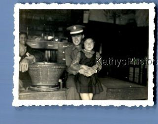 Found B&w Photo F,  5896 Soldier Posed Holding Girl In Dress Sitting On Wall