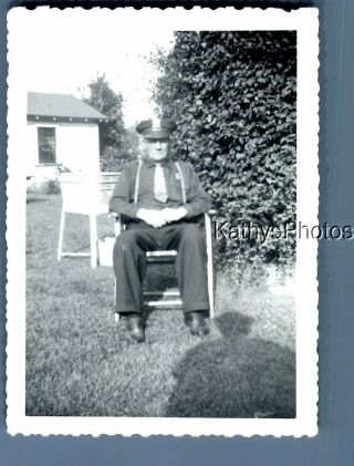 Black & White Photo J_8886 Old Police Officer In Uniform Sitting In Chair