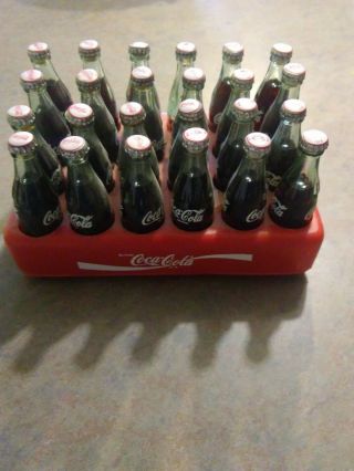 One Case 24 Minature 3in.  Full Coca Cola Bottles W/ Plastic Case Crate