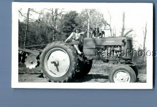 Black & White Photo F,  0153 Little Girl In Dress Sitting On Tractor
