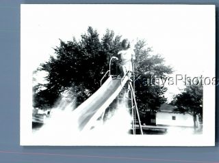 Black & White Photo F,  1514 Pretty Woman Posed On Top Of Slide,  Light Anomaly