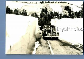Found B&w Photo A_7129 View Of Old Car In Road By Snow Mounds