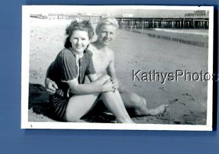 Found B&w Photo A_8059 Man Sitting On Beach With Pretty Woman In Swimsuit