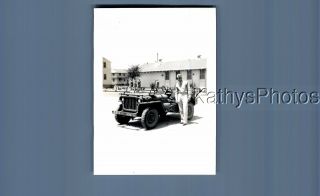 Found B&w Photo F,  5658 Soldier Posed On Side Of Jeep