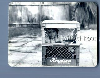 Found B&w Photo F,  6442 Little Girl Sitting In Crates Hiding