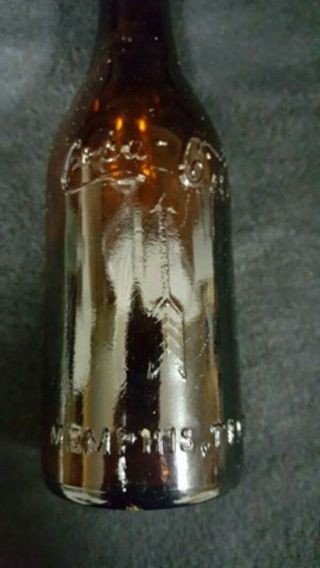 Straight Side - Amber Coca - Cola Bottle with Arrows - - Memphis Tennessee - - 3