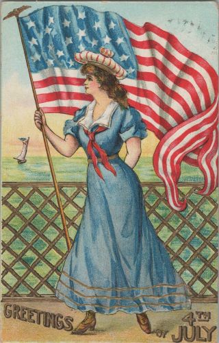 C.  1910 Embossed Patriotic Postcard Woman In Dress Holding Flag 4th Of July C3